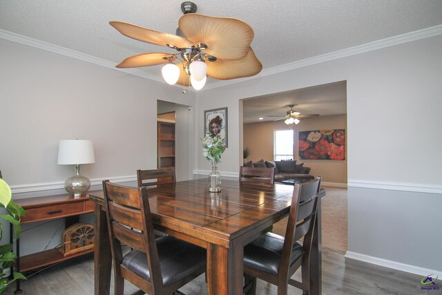 100 Scarlett Dr, Warner Robins, GA 31088 - dining space featuring ceiling fan, crown molding, wood finished floors, and a textured ceiling