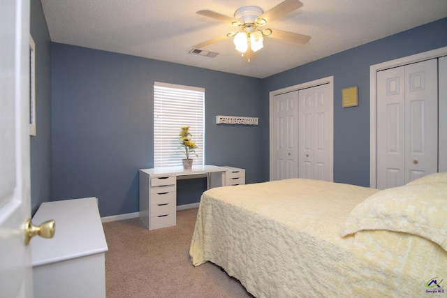 100 Scarlett Dr, Warner Robins, GA 31088 - bedroom with multiple closets, light colored carpet, and a ceiling fan