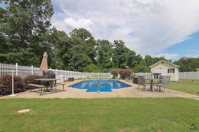 100 Scarlett Dr, Warner Robins, GA 31088 - view of pool with a patio area, a fenced backyard, an outbuilding, and view of wooded area