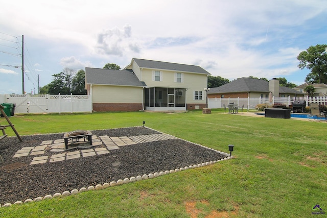 100 Scarlett Dr, Warner Robins, GA 31088 - fenced backyard with an outdoor fire pit, a sunroom, and a patio area