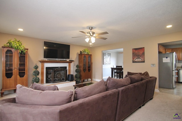 100 Scarlett Dr, Warner Robins, GA 31088 - living room featuring recessed lighting, a glass covered fireplace, and a ceiling fan
