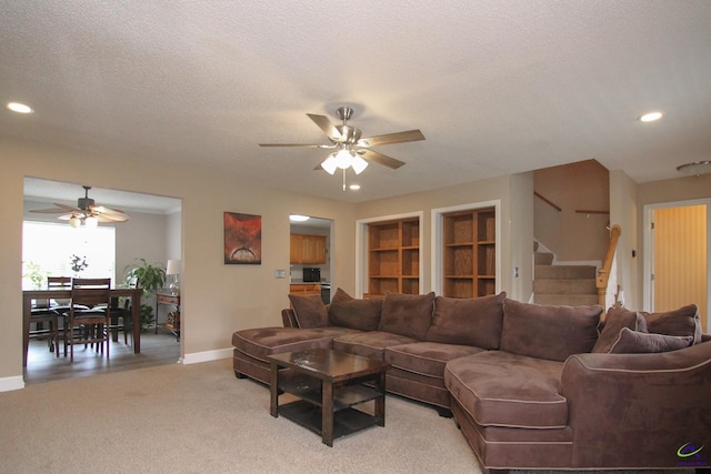 100 Scarlett Dr, Warner Robins, GA 31088 - living area featuring ceiling fan, stairway, recessed lighting, a textured ceiling, and light colored carpet
