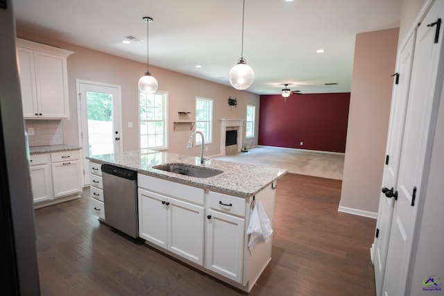 133 W River Cane Run, Perry, GA 31069 - kitchen featuring stainless steel dishwasher, open floor plan, ceiling fan, recessed lighting, and white cabinets