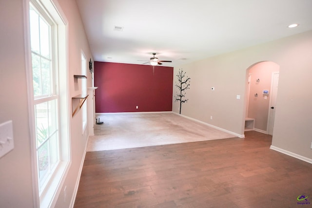 133 W River Cane Run, Perry, GA 31069 - empty room featuring arched walkways, healthy amount of natural light, a ceiling fan, wood finished floors, and recessed lighting