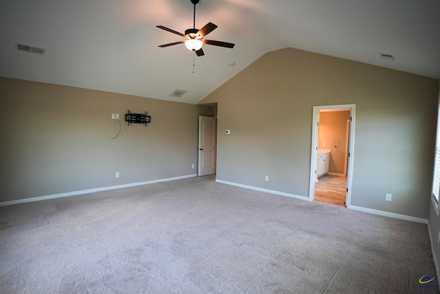 133 W River Cane Run, Perry, GA 31069 - unfurnished bedroom with lofted ceiling, light carpet, connected bathroom, and ceiling fan