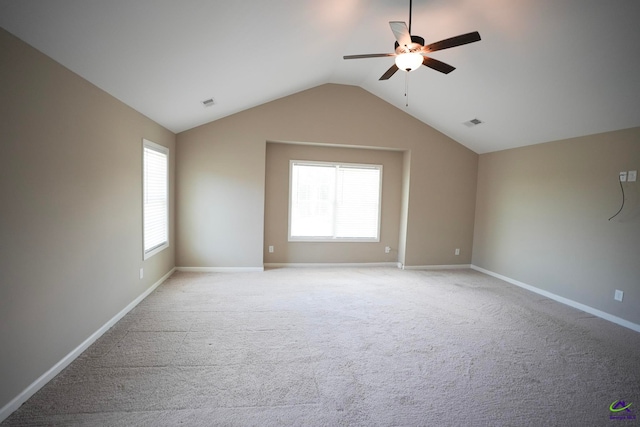 133 W River Cane Run, Perry, GA 31069 - empty room featuring ceiling fan, vaulted ceiling, plenty of natural light, and light colored carpet