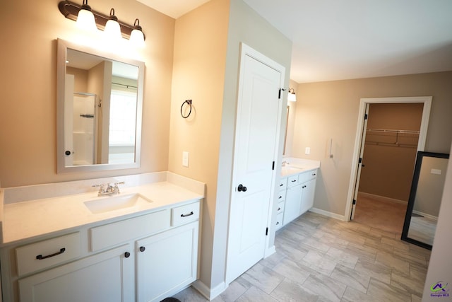 133 W River Cane Run, Perry, GA 31069 - full bathroom with vanity, a walk in closet, and a shower