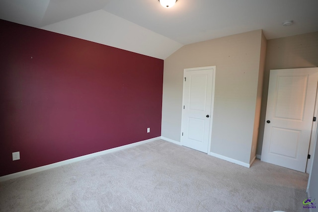 133 W River Cane Run, Perry, GA 31069 - unfurnished bedroom with light colored carpet and vaulted ceiling