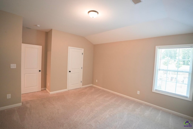 133 W River Cane Run, Perry, GA 31069 - unfurnished bedroom featuring light carpet and lofted ceiling
