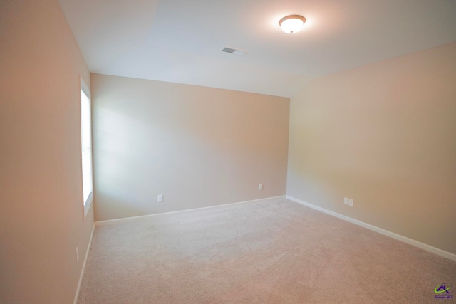 133 W River Cane Run, Perry, GA 31069 - spare room featuring healthy amount of natural light, light colored carpet, and lofted ceiling