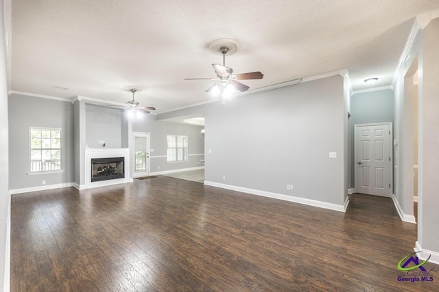 310 Woods Edge Way, Warner Robins, GA 31088 - unfurnished living room featuring ceiling fan, crown molding, wood finished floors, and a fireplace