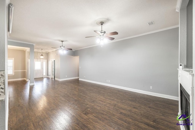 310 Woods Edge Way, Warner Robins, GA 31088 - unfurnished living room with ceiling fan, crown molding, dark wood-type flooring, and a fireplace