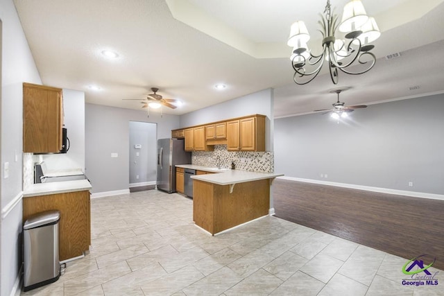310 Woods Edge Way, Warner Robins, GA 31088 - kitchen with a ceiling fan, stainless steel appliances, a peninsula, brown cabinets, and recessed lighting