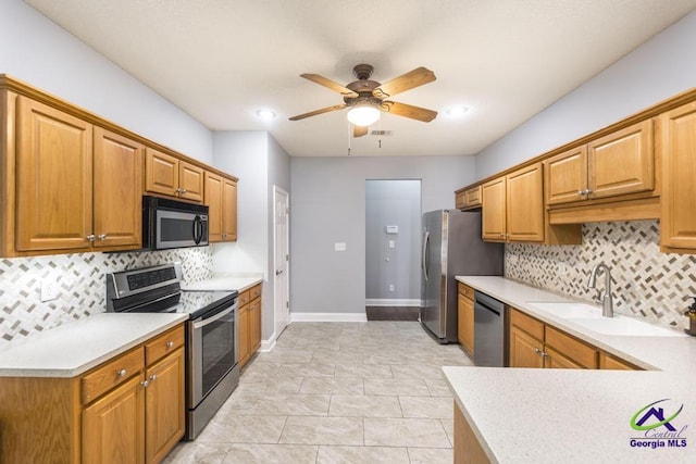 310 Woods Edge Way, Warner Robins, GA 31088 - kitchen featuring stainless steel appliances, ceiling fan, backsplash, light countertops, and recessed lighting