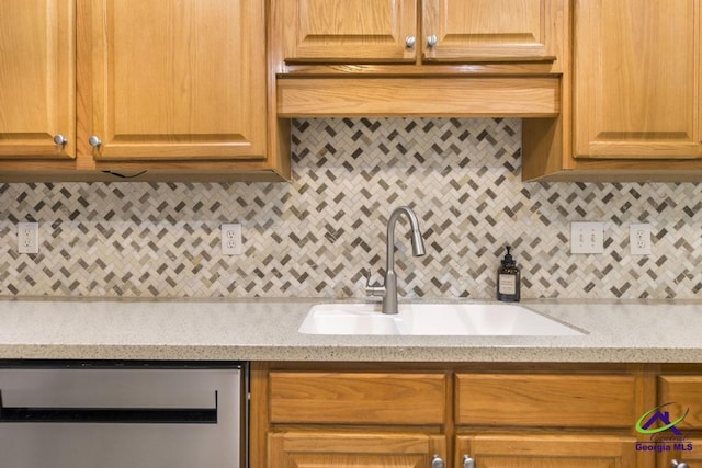 310 Woods Edge Way, Warner Robins, GA 31088 - kitchen featuring stainless steel dishwasher, backsplash, and light stone counters