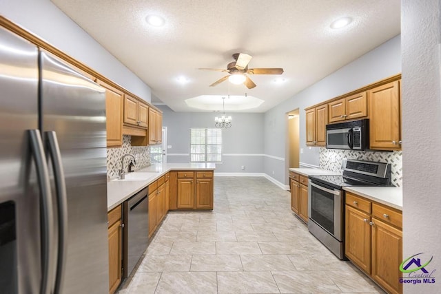 310 Woods Edge Way, Warner Robins, GA 31088 - kitchen featuring stainless steel appliances, a peninsula, ceiling fan, tasteful backsplash, and recessed lighting