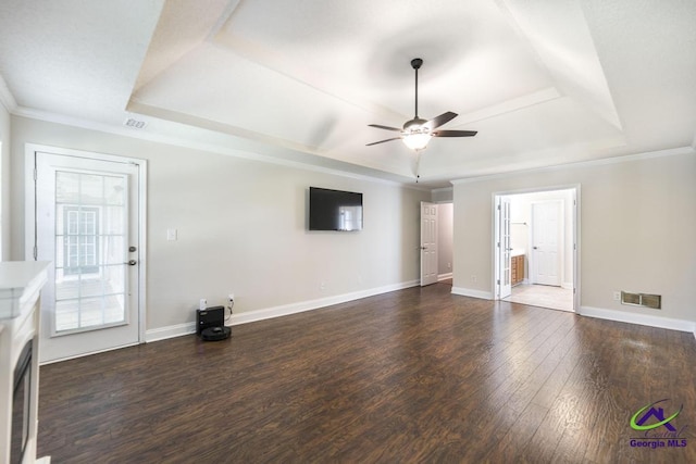 310 Woods Edge Way, Warner Robins, GA 31088 - unfurnished living room featuring a raised ceiling, a ceiling fan, wood finished floors, and ornamental molding