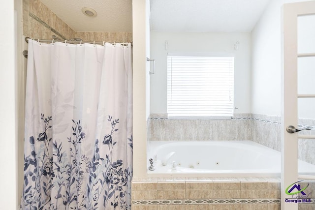 310 Woods Edge Way, Warner Robins, GA 31088 - bathroom featuring a tub with jets and a shower with curtain