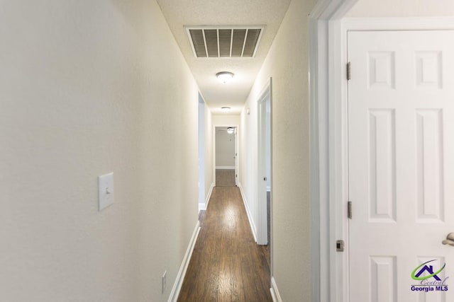 310 Woods Edge Way, Warner Robins, GA 31088 - hallway with dark wood-style floors and baseboards