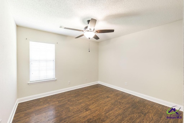 310 Woods Edge Way, Warner Robins, GA 31088 - spare room with dark wood-style flooring, ceiling fan, and a textured ceiling