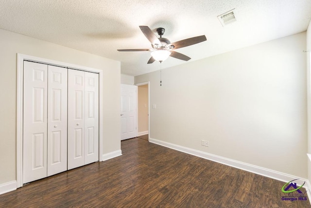 310 Woods Edge Way, Warner Robins, GA 31088 - unfurnished bedroom featuring dark wood-style flooring, a closet, and ceiling fan