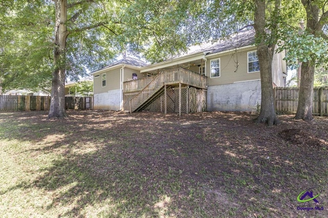 310 Woods Edge Way, Warner Robins, GA 31088 - rear view of house featuring stairway, a fenced backyard, and a wooden deck