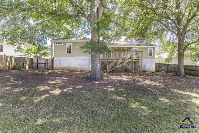 310 Woods Edge Way, Warner Robins, GA 31088 - rear view of house with stairs, a fenced backyard, and a deck