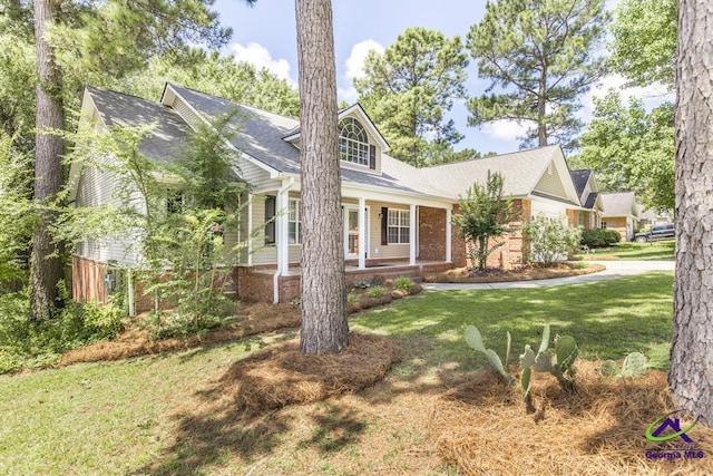 310 Woods Edge Way, Warner Robins, GA 31088 - view of front of house with a porch and brick siding