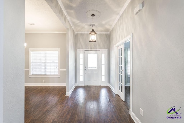 310 Woods Edge Way, Warner Robins, GA 31088 - foyer with crown molding, wood finished floors, and a textured ceiling