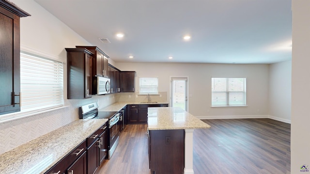 463 Southern Oaks Dr, Macon, GA 31216 - kitchen with stainless steel appliances, dark wood-type flooring, dark brown cabinetry, a center island, and recessed lighting