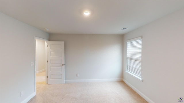 463 Southern Oaks Dr, Macon, GA 31216 - empty room with light colored carpet and a smoke detector