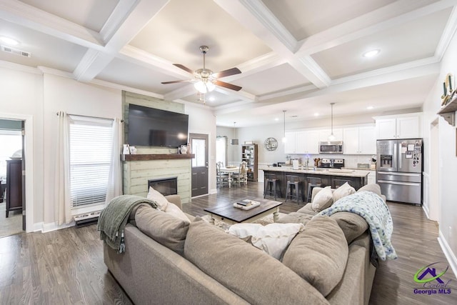 103 Cascades Ct, Bonaire, GA 31005 - living room with a ceiling fan, coffered ceiling, beamed ceiling, recessed lighting, and a large fireplace
