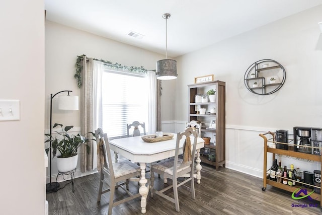 103 Cascades Ct, Bonaire, GA 31005 - dining room with dark wood-type flooring and wainscoting