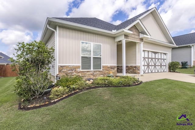 103 Cascades Ct, Bonaire, GA 31005 - craftsman-style house with stone siding, driveway, an attached garage, and roof with shingles