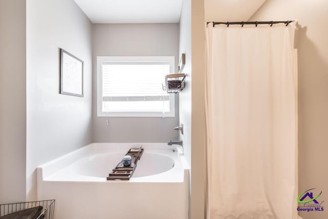 103 Cascades Ct, Bonaire, GA 31005 - full bathroom featuring a garden tub and a shower with shower curtain