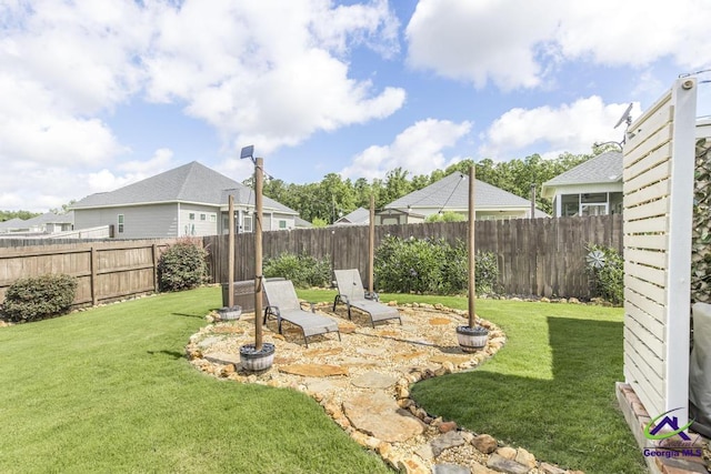 103 Cascades Ct, Bonaire, GA 31005 - fenced backyard with a patio area