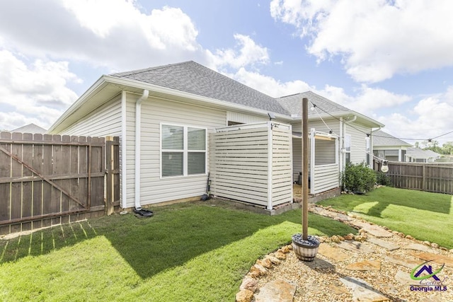 103 Cascades Ct, Bonaire, GA 31005 - back of property featuring roof with shingles