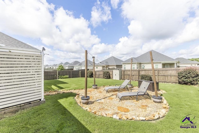 103 Cascades Ct, Bonaire, GA 31005 - fenced backyard with a storage unit, a residential view, and a patio area