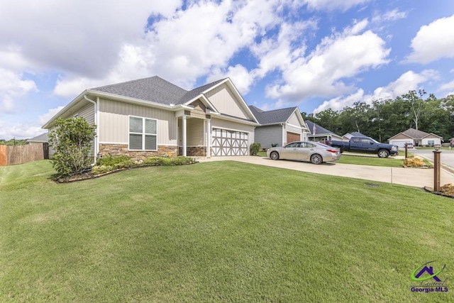 103 Cascades Ct, Bonaire, GA 31005 - craftsman-style home with concrete driveway, board and batten siding, stone siding, and an attached garage