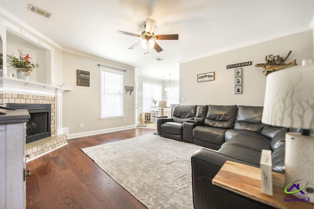 112 Verandah Ct, Bonaire, GA 31005 - living area with ceiling fan, ornamental molding, dark wood-style flooring, and a fireplace with raised hearth