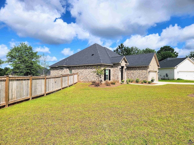 109 Raspberry Trl, Perry, GA 31069 - view of front of home featuring an attached garage, brick siding, driveway, and roof with shingles