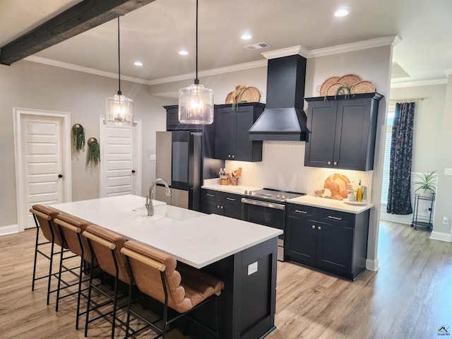 109 Raspberry Trl, Perry, GA 31069 - kitchen with custom range hood, stainless steel electric range oven, light wood-style floors, a kitchen breakfast bar, and recessed lighting