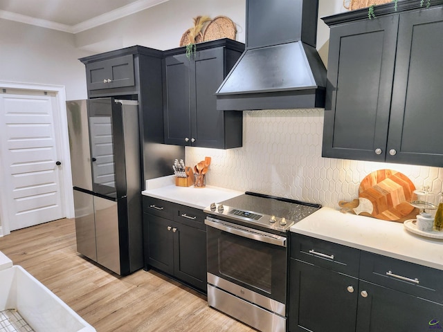 109 Raspberry Trl, Perry, GA 31069 - kitchen featuring custom range hood, stainless steel appliances, crown molding, backsplash, and light countertops