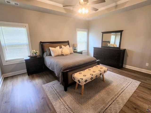 109 Raspberry Trl, Perry, GA 31069 - bedroom with wood finished floors, a ceiling fan, crown molding, and a tray ceiling