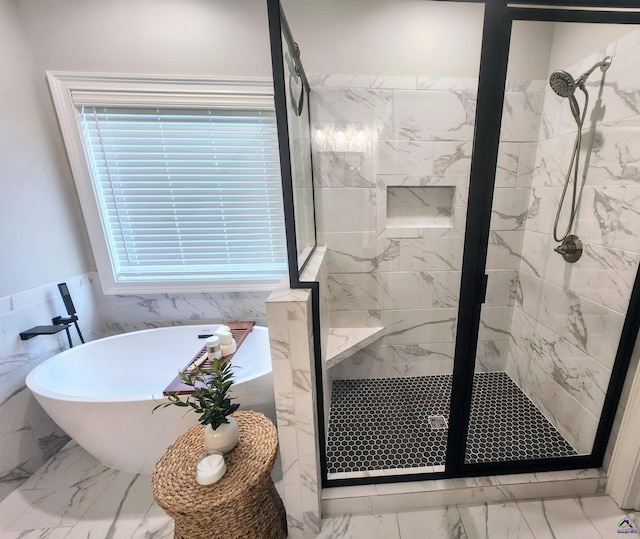 109 Raspberry Trl, Perry, GA 31069 - bathroom with marble finish floors, a marble finish shower, and a freestanding bath