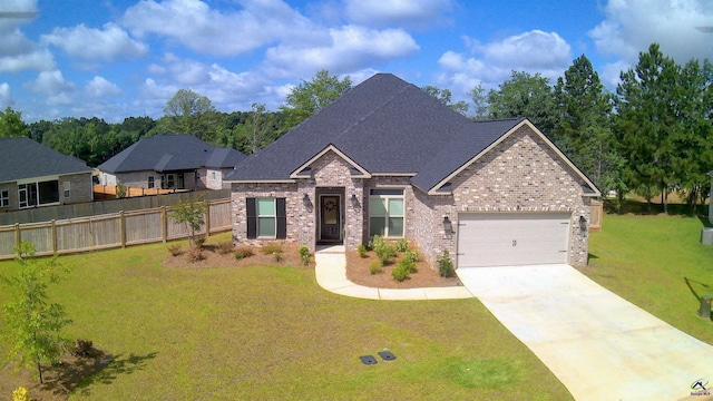 109 Raspberry Trl, Perry, GA 31069 - view of front facade with brick siding, concrete driveway, a garage, and a shingled roof