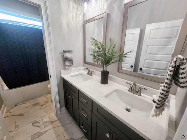 109 Raspberry Trl, Perry, GA 31069 - bathroom featuring double vanity, marble finish floors, and shower / tub combo with curtain