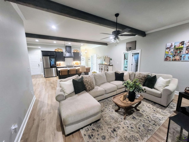 109 Raspberry Trl, Perry, GA 31069 - living area with light wood-style floors, beamed ceiling, ceiling fan, and recessed lighting