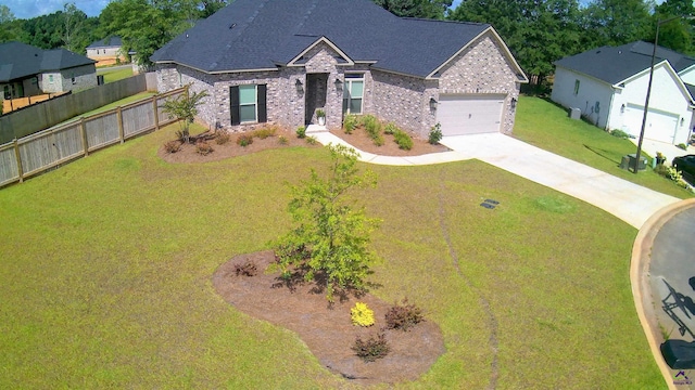 109 Raspberry Trl, Perry, GA 31069 - view of front of property featuring brick siding, driveway, a garage, and roof with shingles