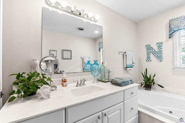 113 Chestnut Rd, Warner Robins, GA 31088 - bathroom with vanity and a tub with jets